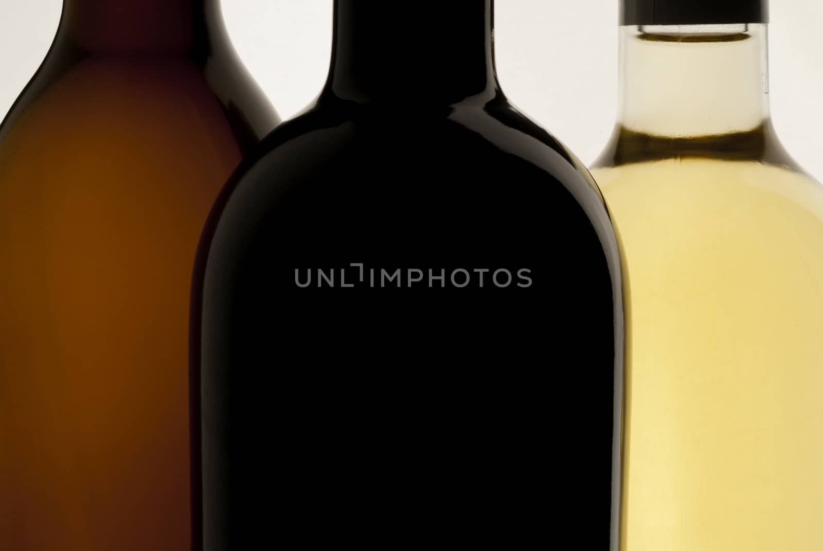 Three bottles of wine, white background, red wine and white wine