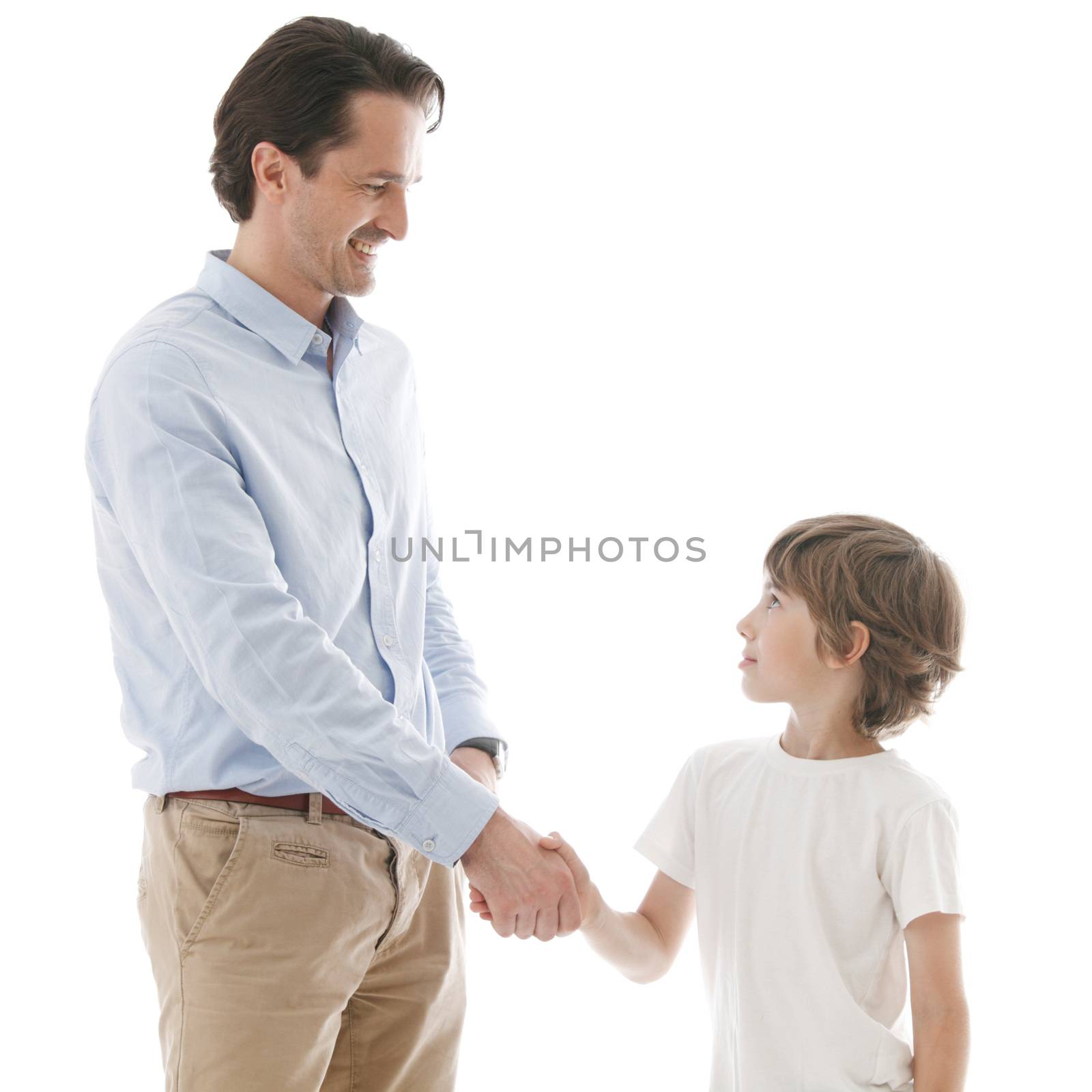 Cheerful father and son shaking hands isolated on white background family unity concept