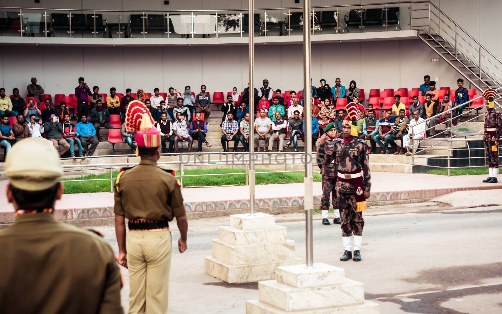 Petrapole-Benapole, Bangaon, 5th Jan, 2019: Joint Retreat of lowering of national flags Ceremony, a military show as Wagah Border with soldiers of Border Guard Security Force of India and Bangladesh. by sudiptabhowmick