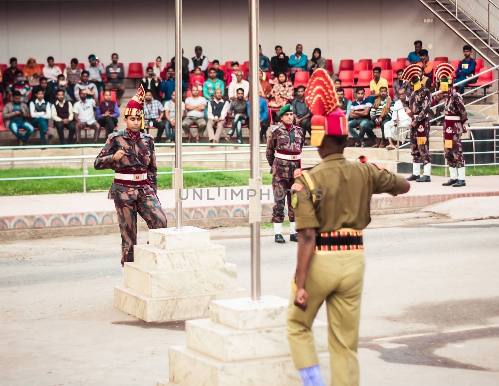 Petrapole-Benapole, Bangaon, 5th Jan, 2019: Joint Retreat of lowering of national flags Ceremony, a military show as Wagah Border with soldiers of Border Guard Security Force of India and Bangladesh. by sudiptabhowmick