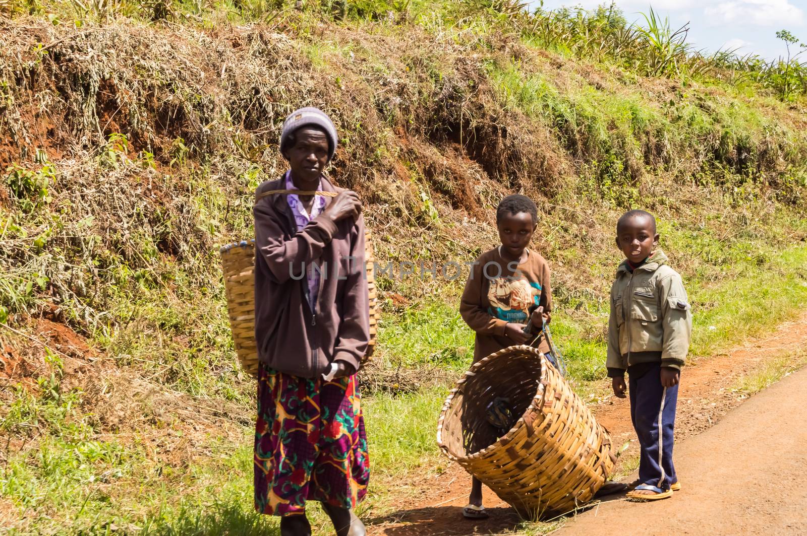 KENYA, THIKA - 03 January 2019: Old woman and her two children r by Philou1000