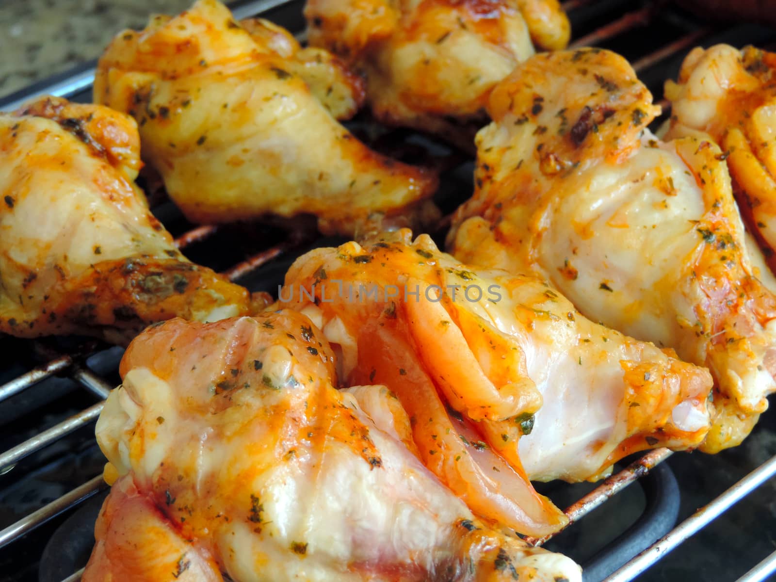 Some Grilled chicken Legs on the grill
