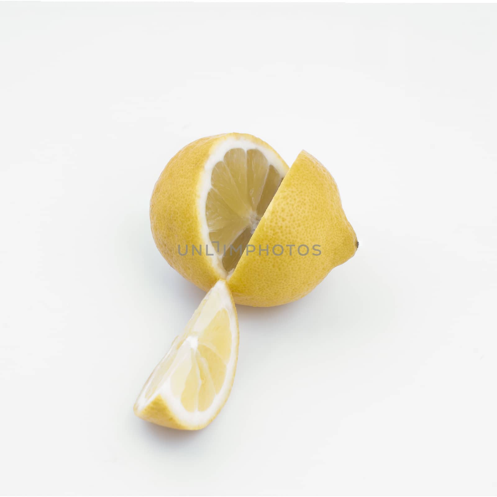 A lemon cut on a white surface