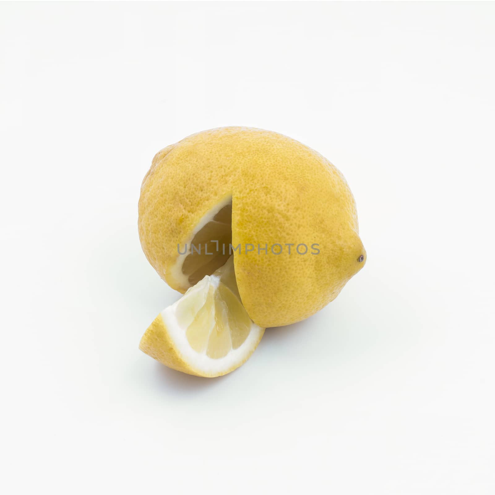 A lemon cut on a white surface