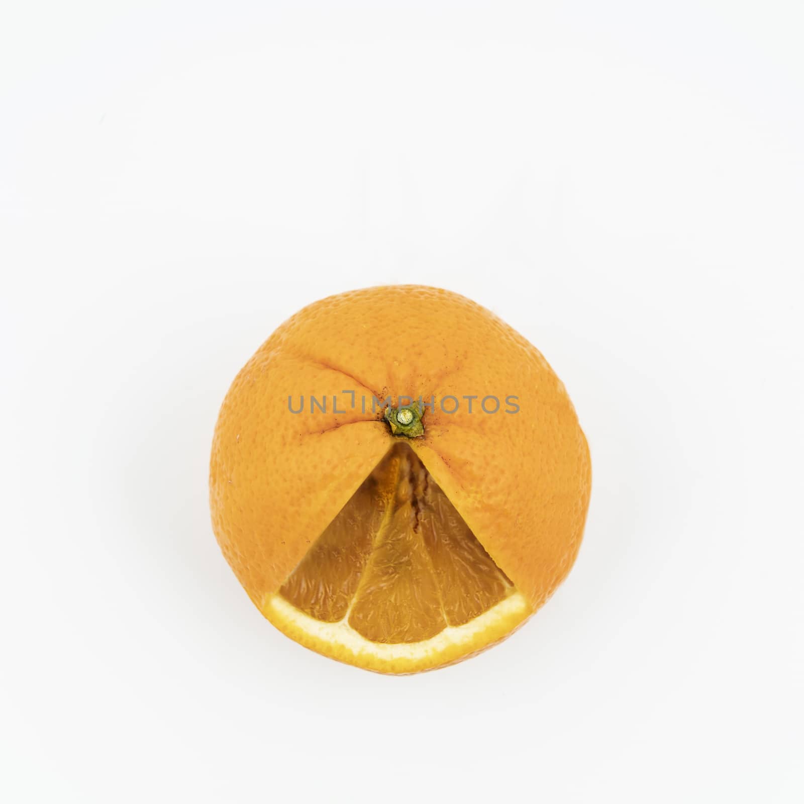 an orange cut on a white surface