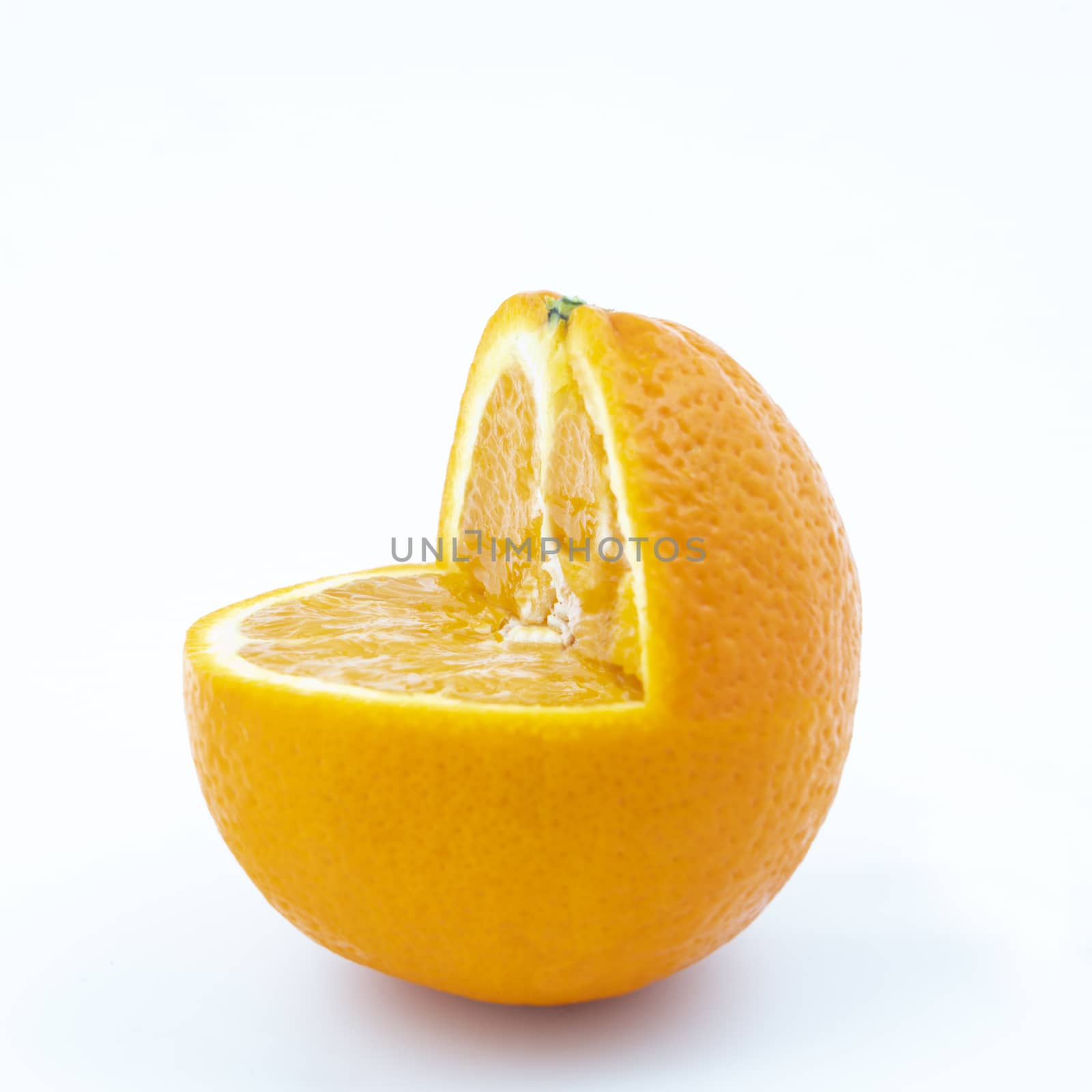 an orange cut on a white surface