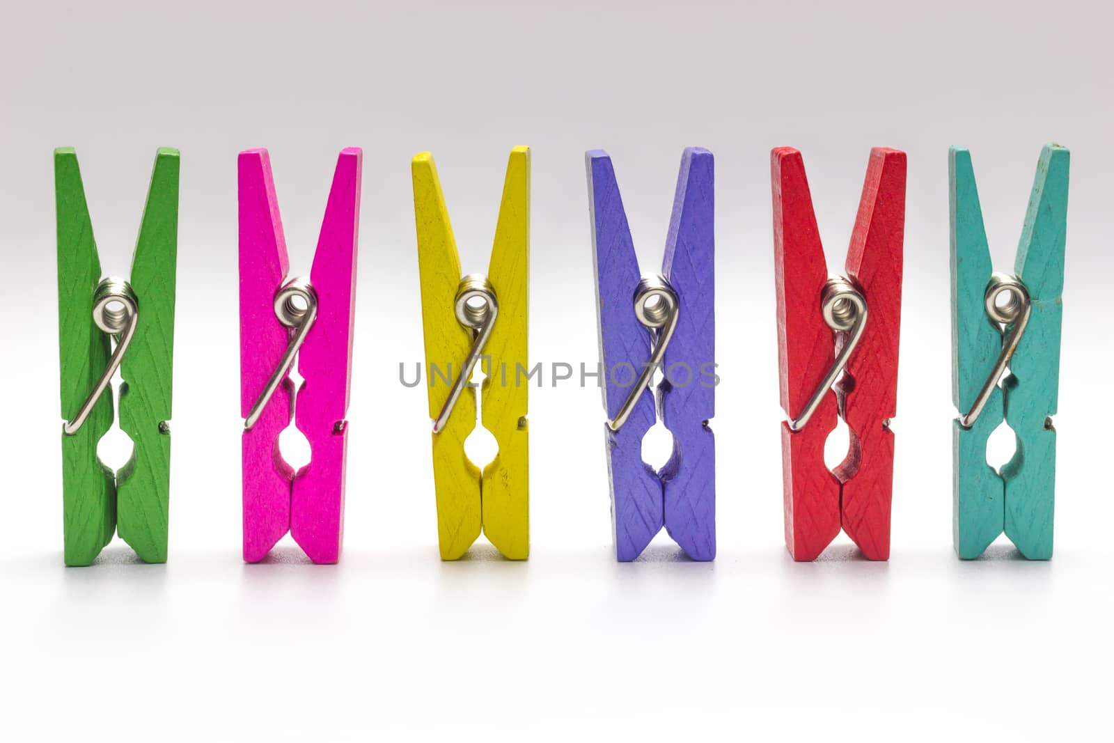 Colorful clothespin. Multicolor Wooden clip set on white background.