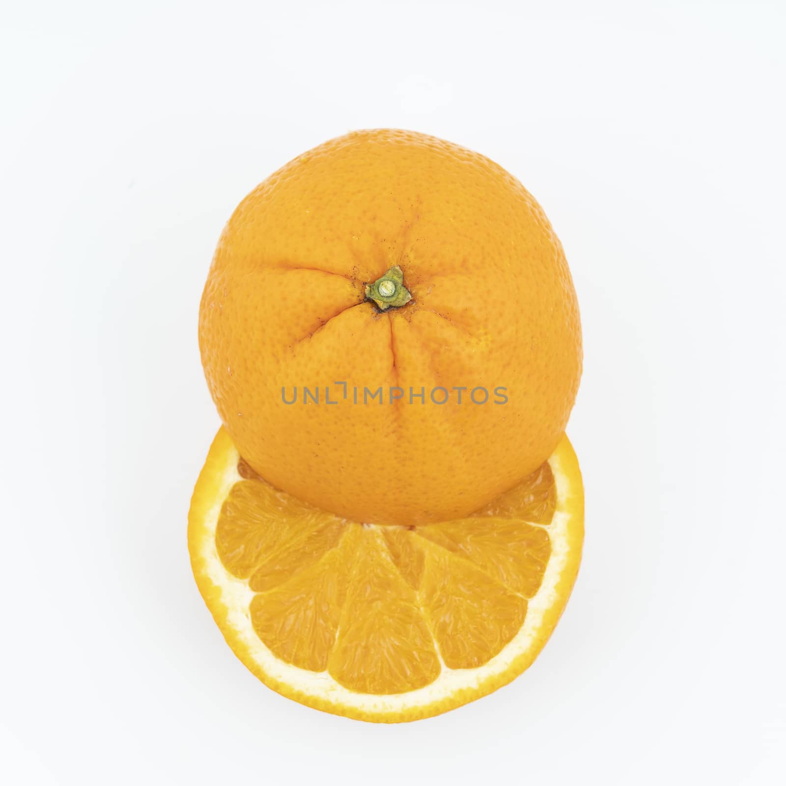 an orange cut on a white surface