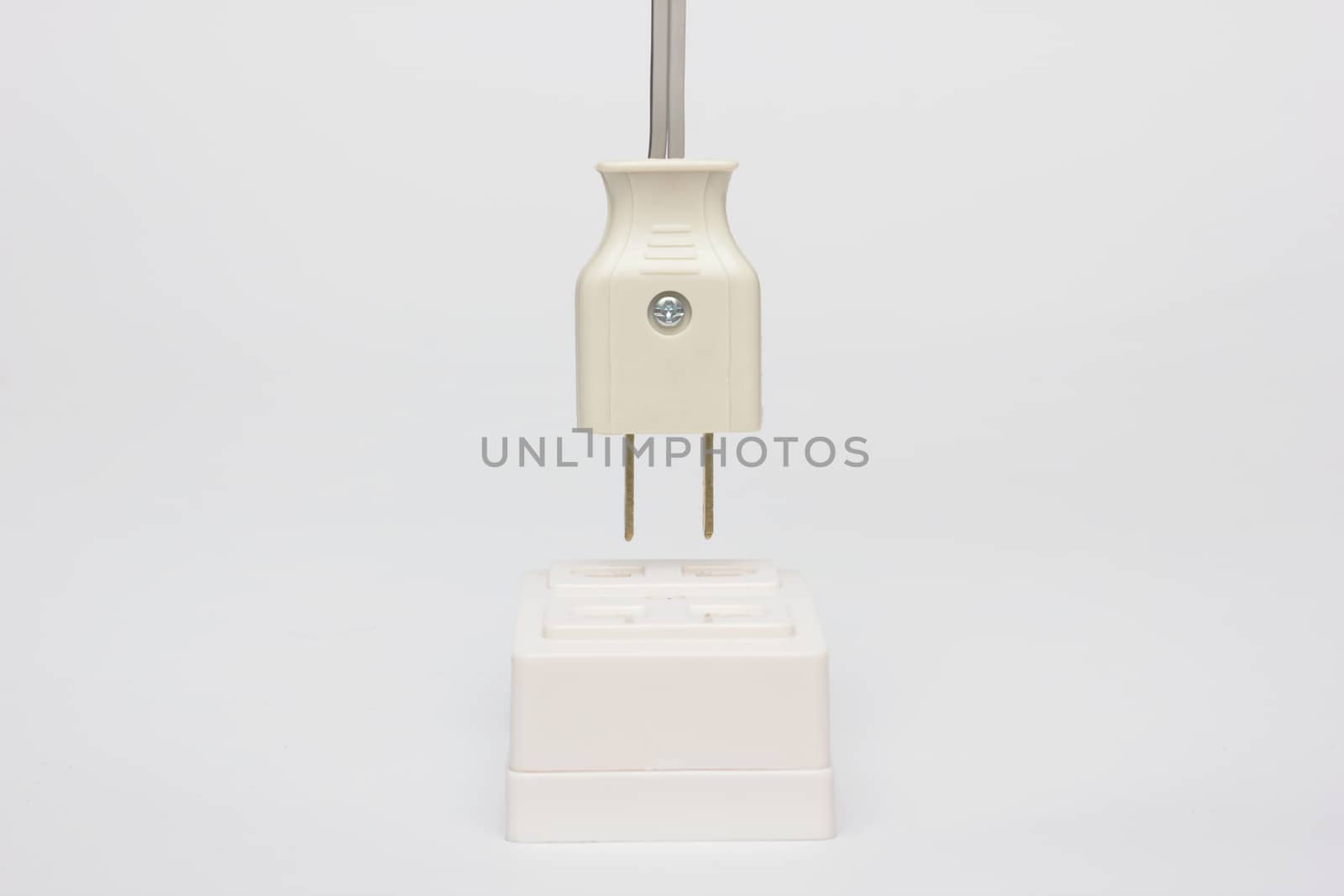 AC power plug with electrical cable on white background.