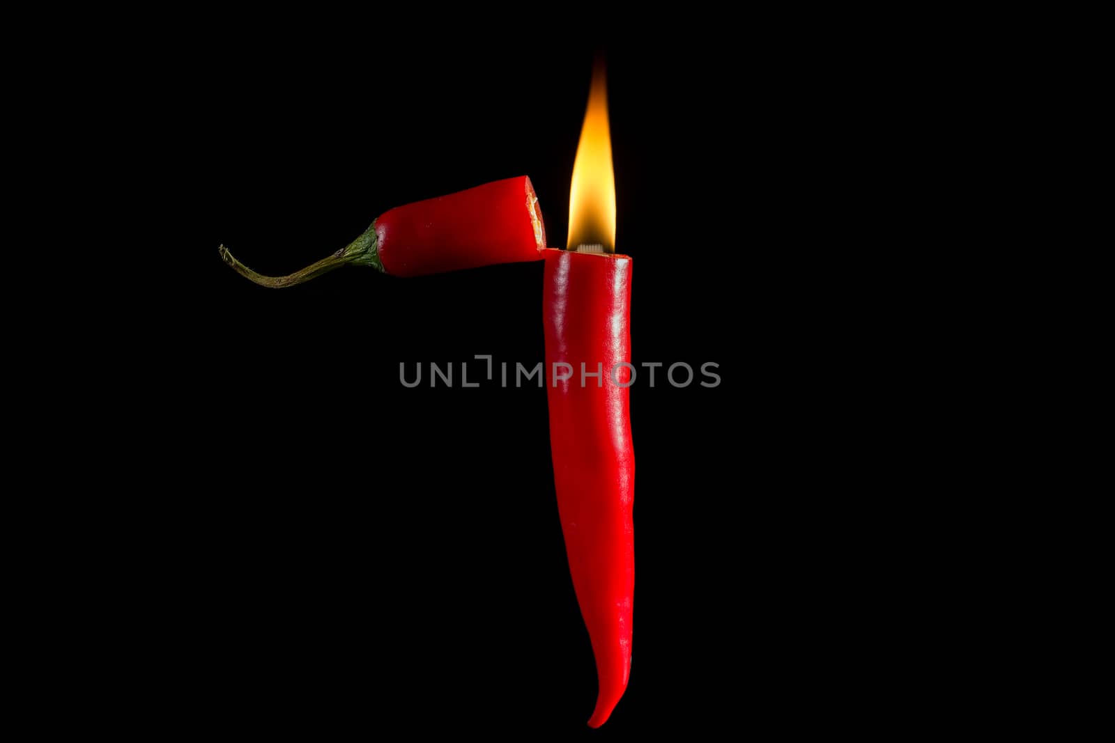 Fire of chili, Hot chili lighter on dark background.