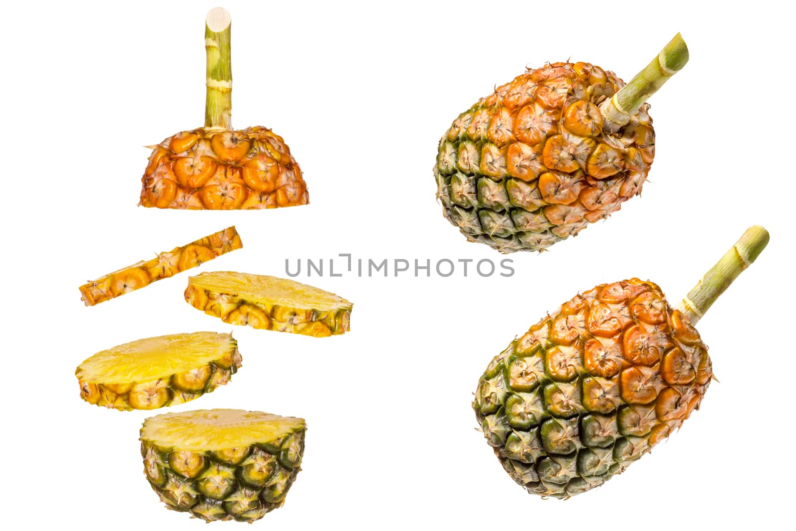 Pineapple is sliced into stack layers on white background. by SaitanSainam