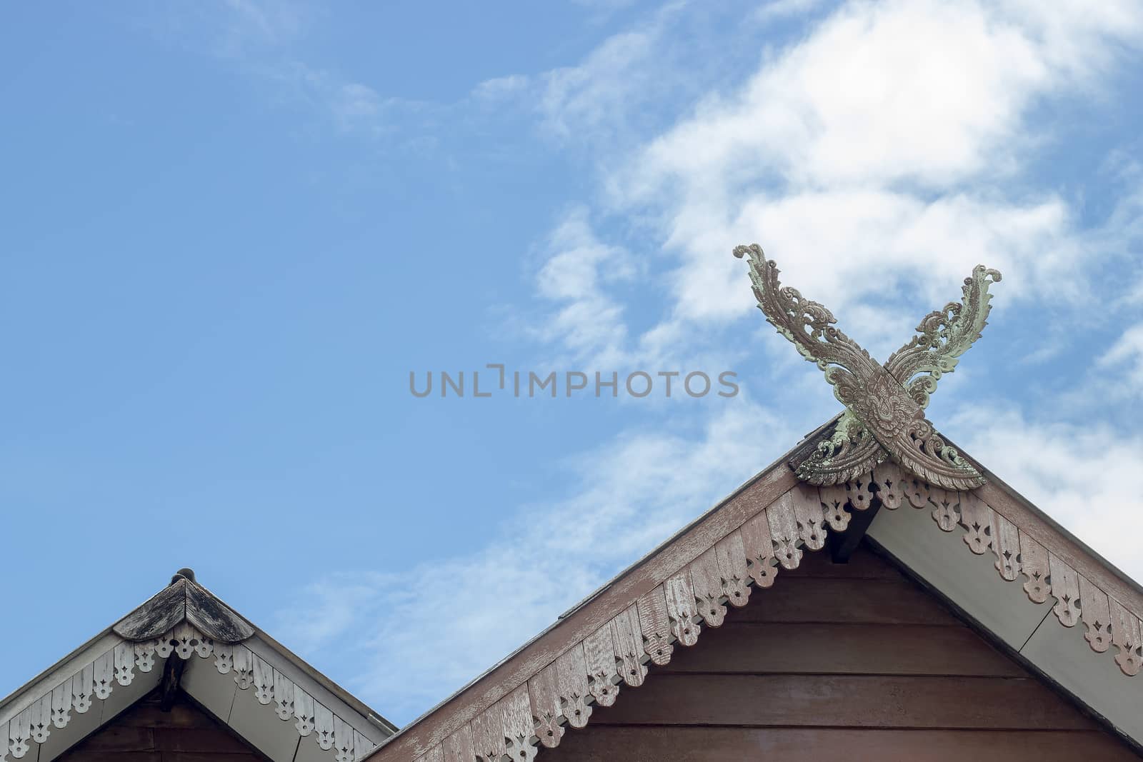 Gable roof house in Thai style and White clouds and beautiful cl by SaitanSainam