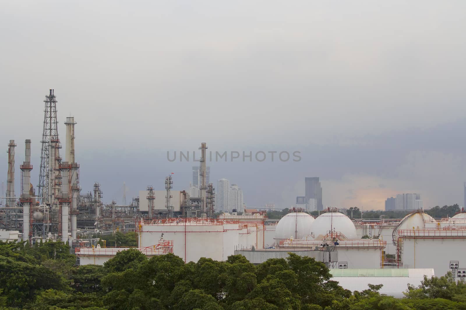 Oil refinery with evening sky. by TakerWalker