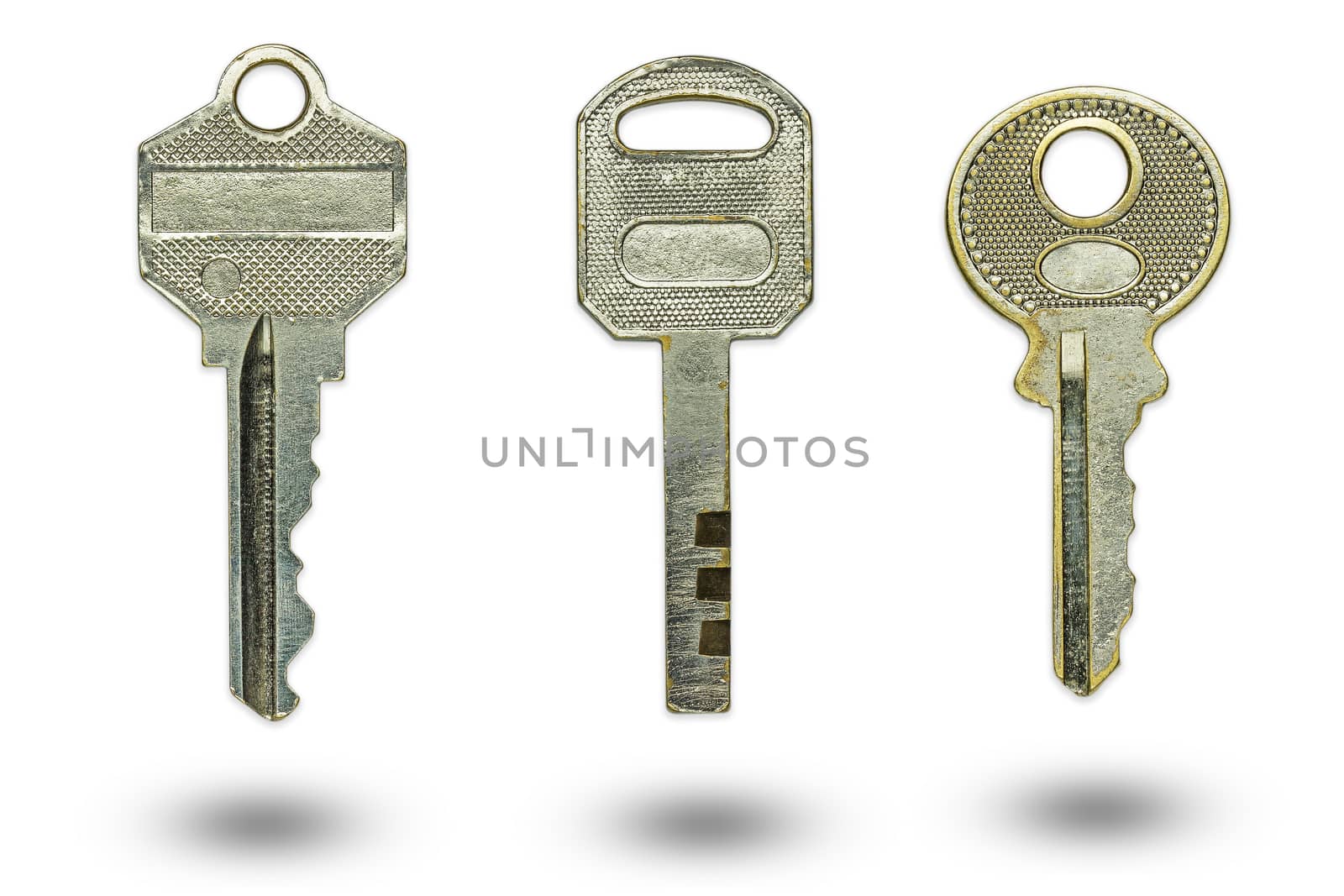 Three different keys on a white background. The concept of confidentiality or security of sensitive information.