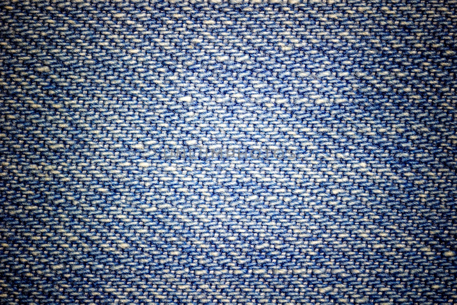 Closeup texture of blue jeans. Suitable for making backgrounds,  by SaitanSainam