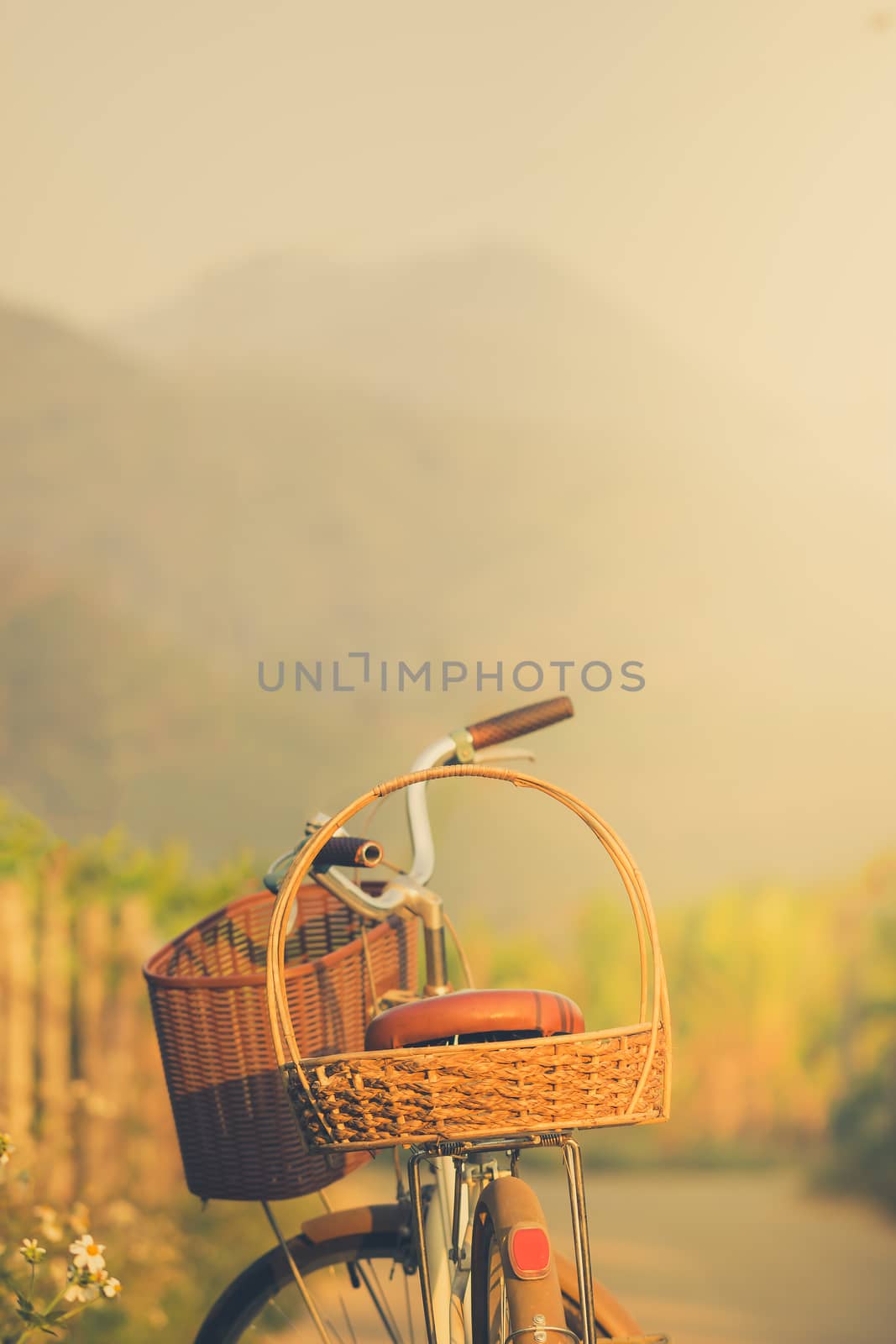 Bicycle on the side of the road way with mountains background. Copy space for text or article.