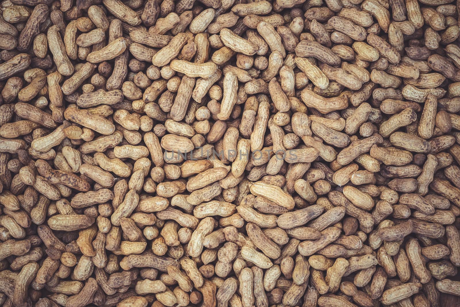 Texture of many peanuts are dried in the sun. Concept of agriculture or harvesting.