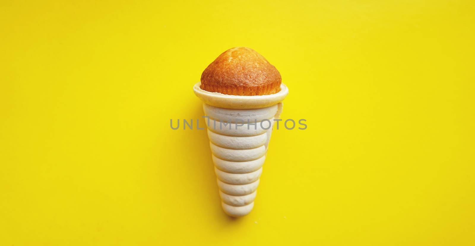 Icecream waffle cone isolated on yellow background by natali_brill