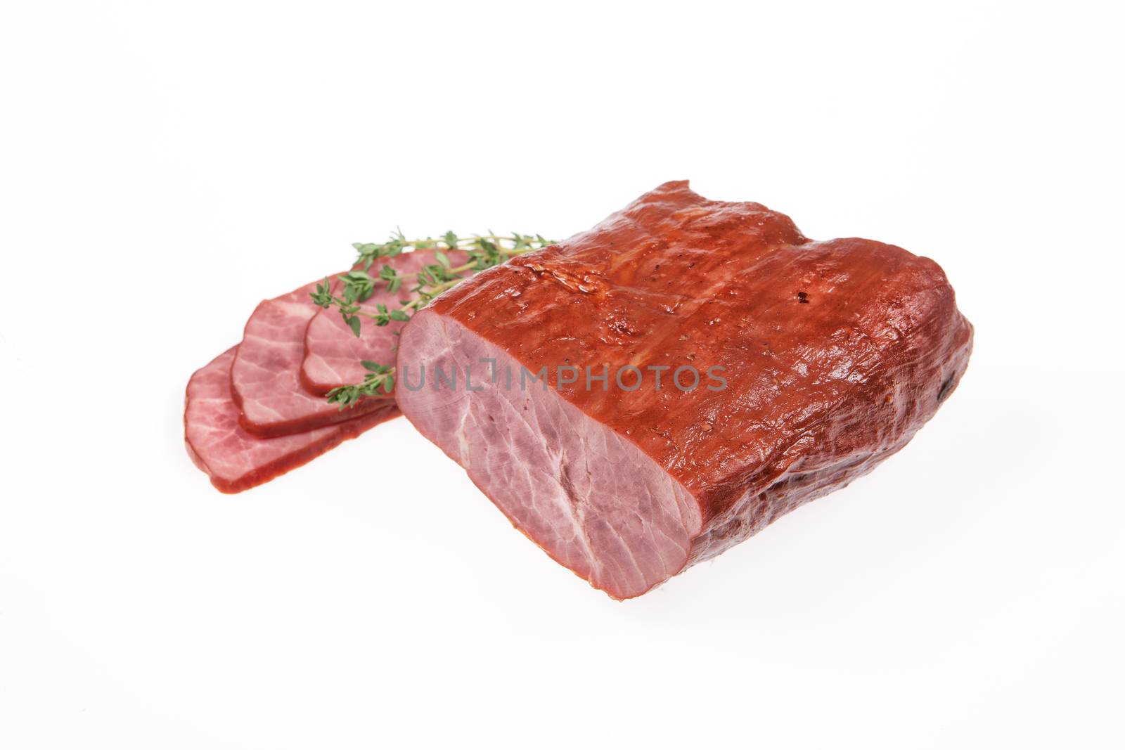Ham and greenery on an isolated studio background