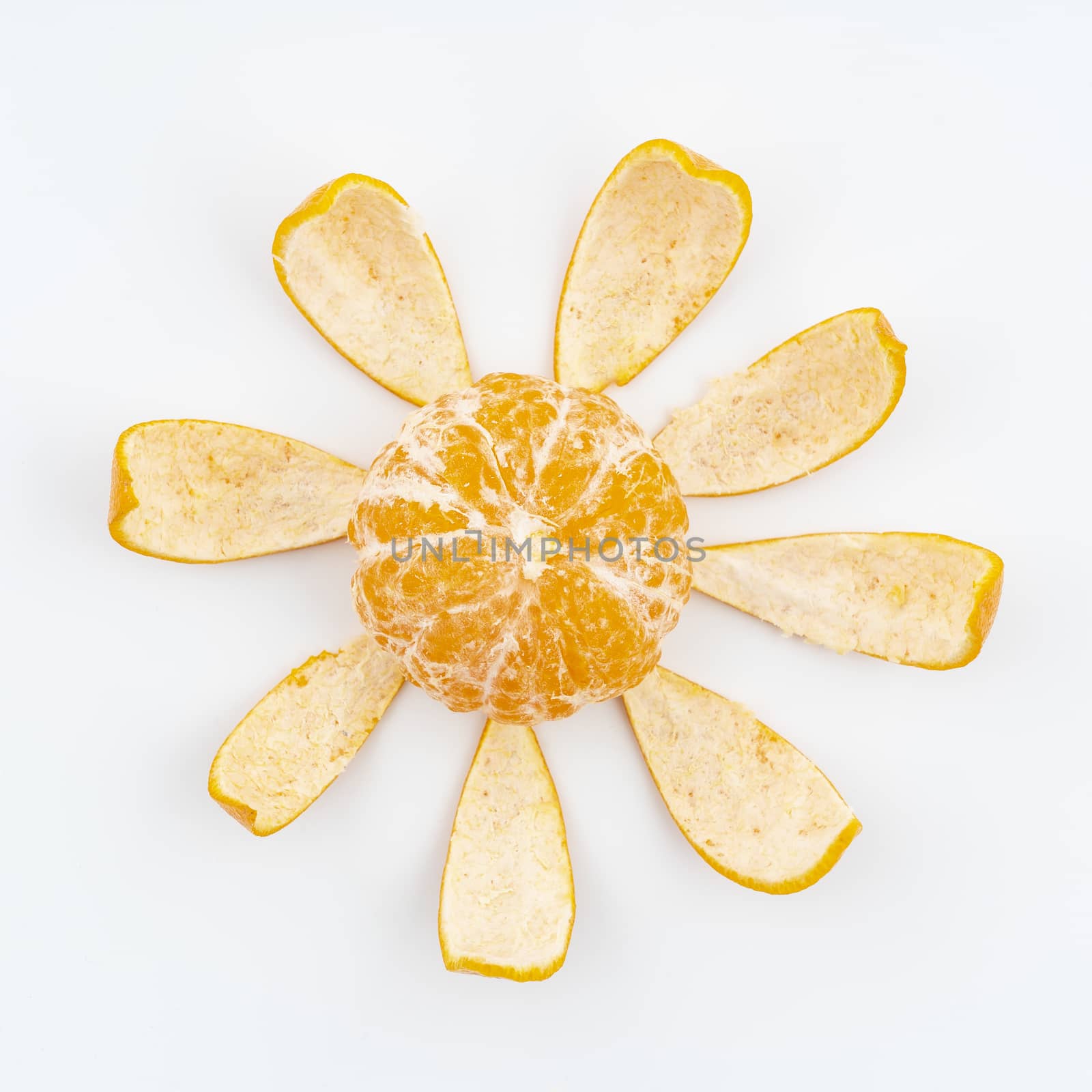 a tangerine peeled on a white surface