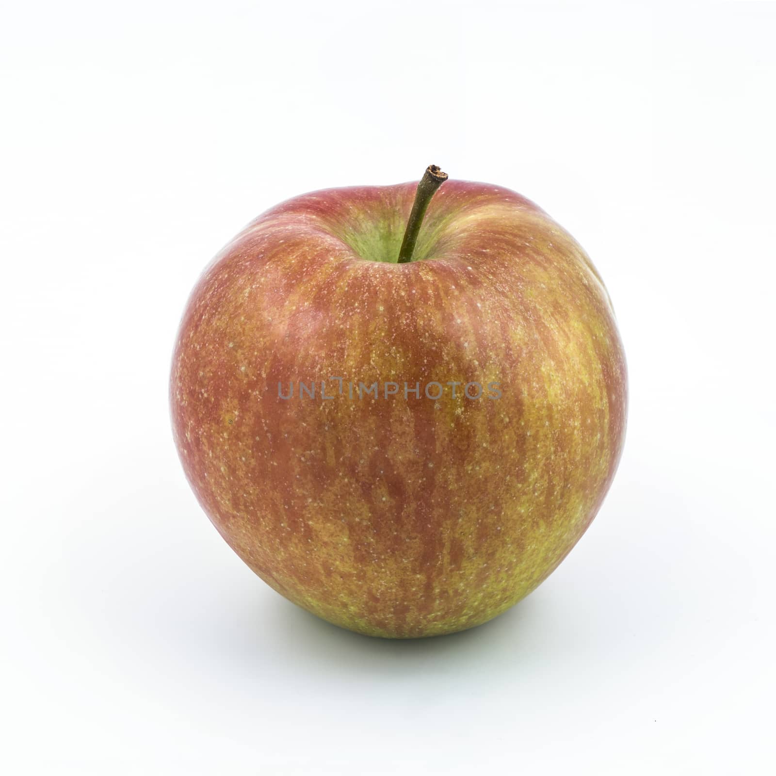a red apple isolated on a white surface