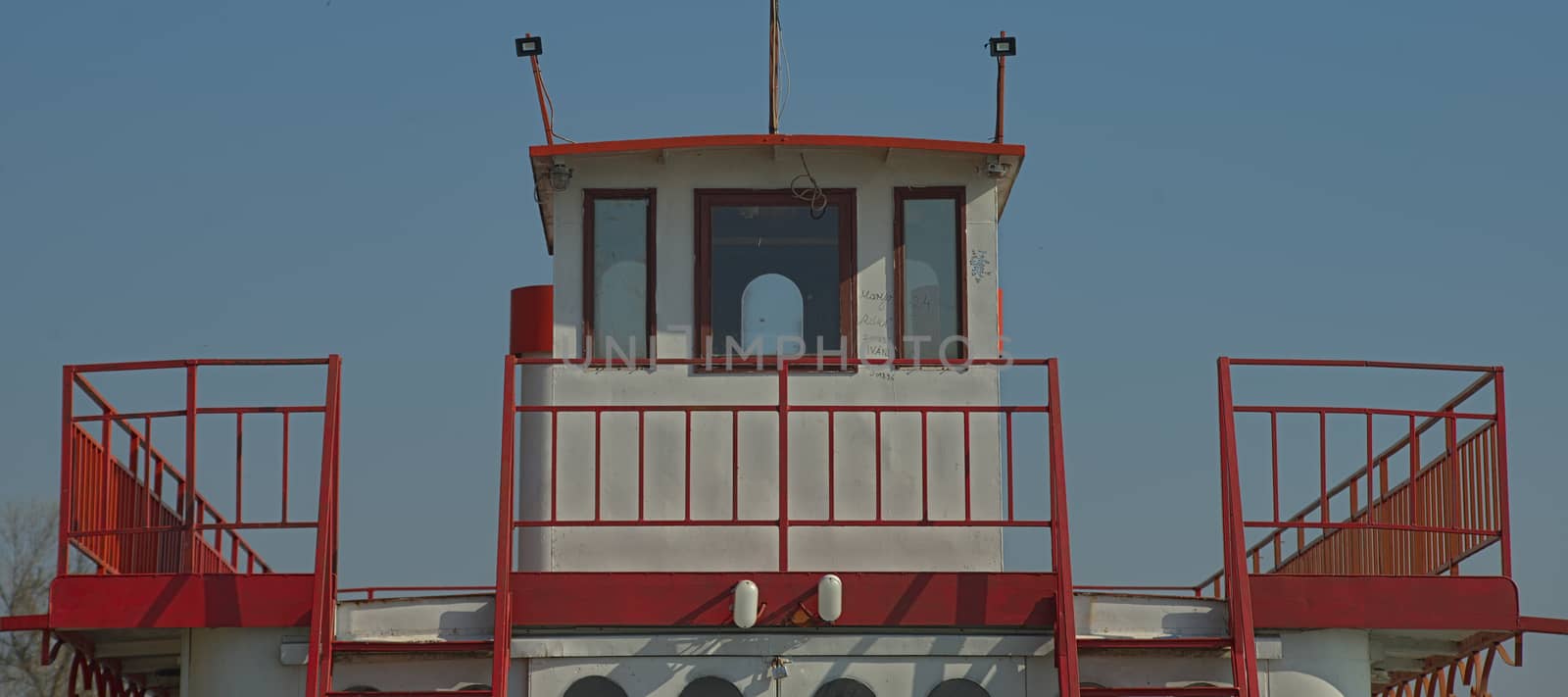 Front view on a top white and red boat