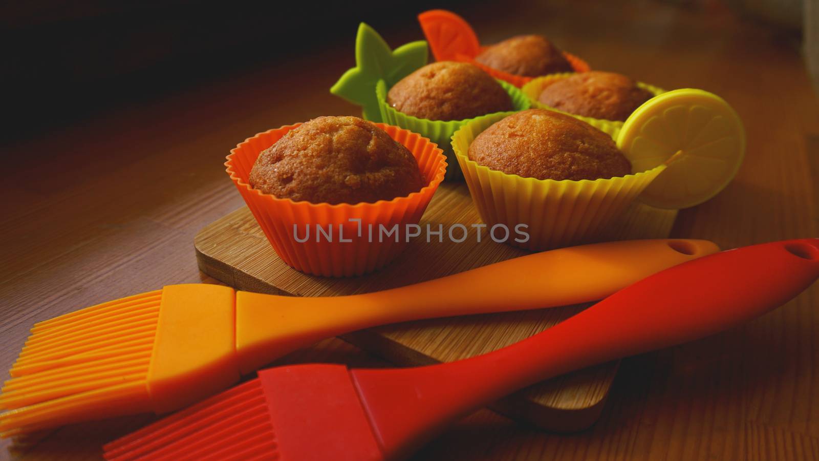 Simple mini muffins in colorful silicone bakeware. Kitchen and cooking concept by natali_brill