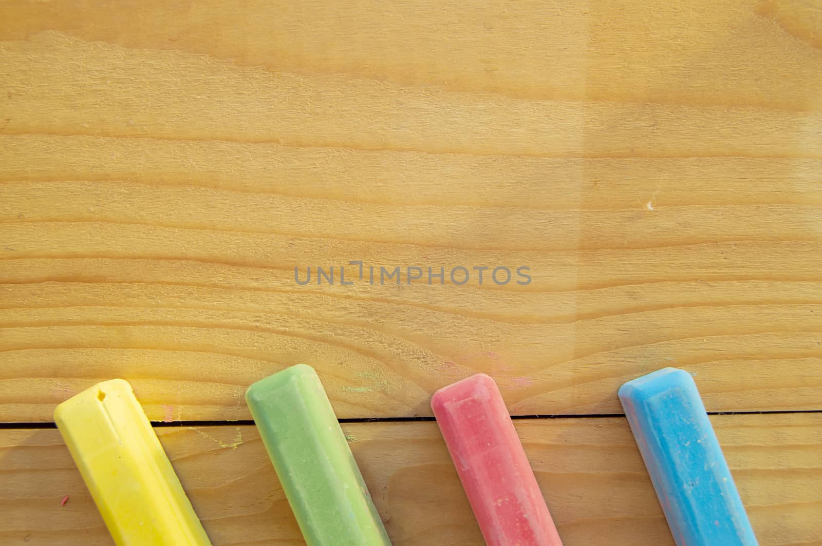 School supplies colored crayons on a light background of the Board stationery. Back to school, the concept of minimalism, flat lay, copyspace by claire_lucia