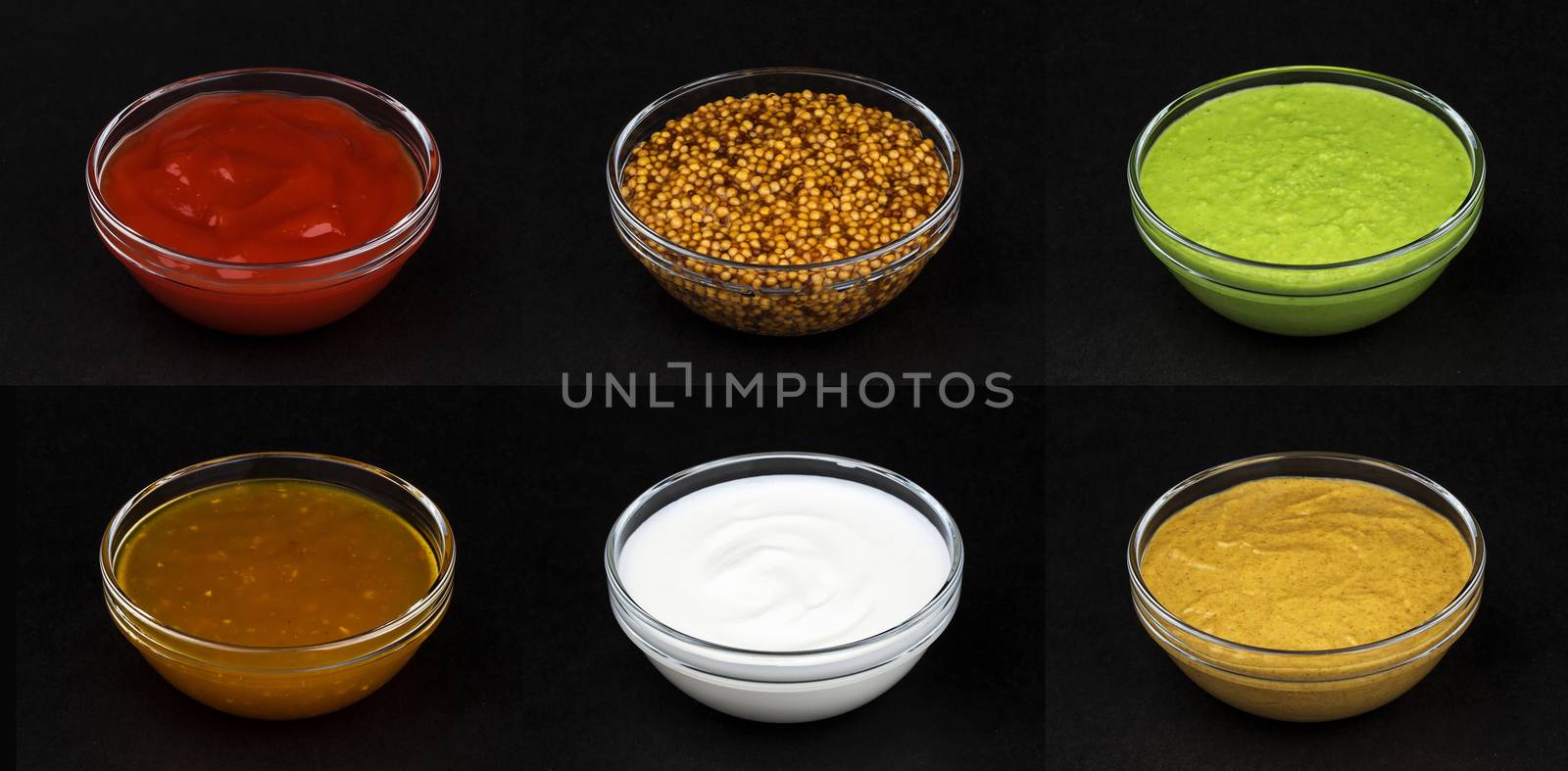 Set of different sauces isolated on black background