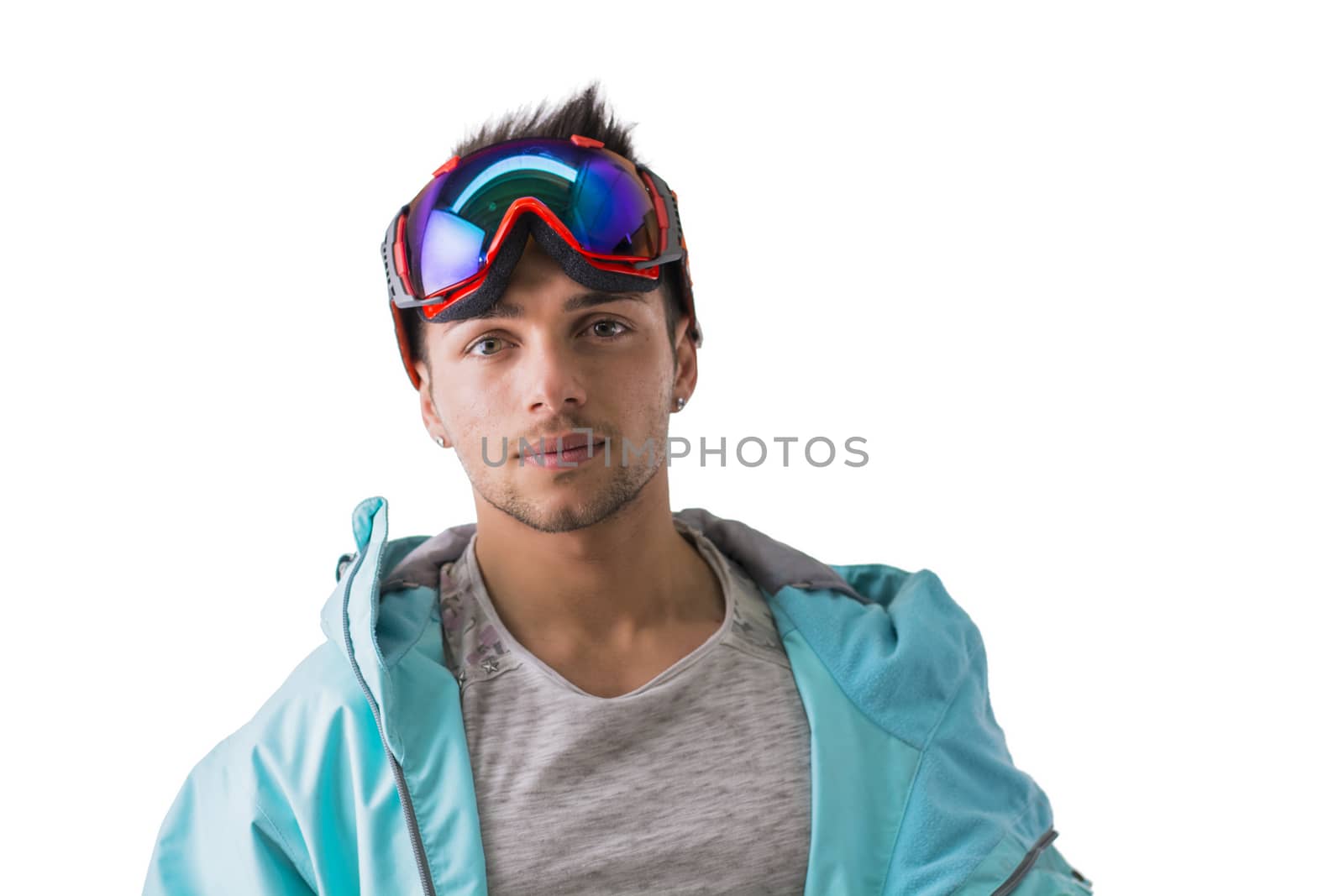 Friendly attractive young male skier or snowboarder isolated on white smiling