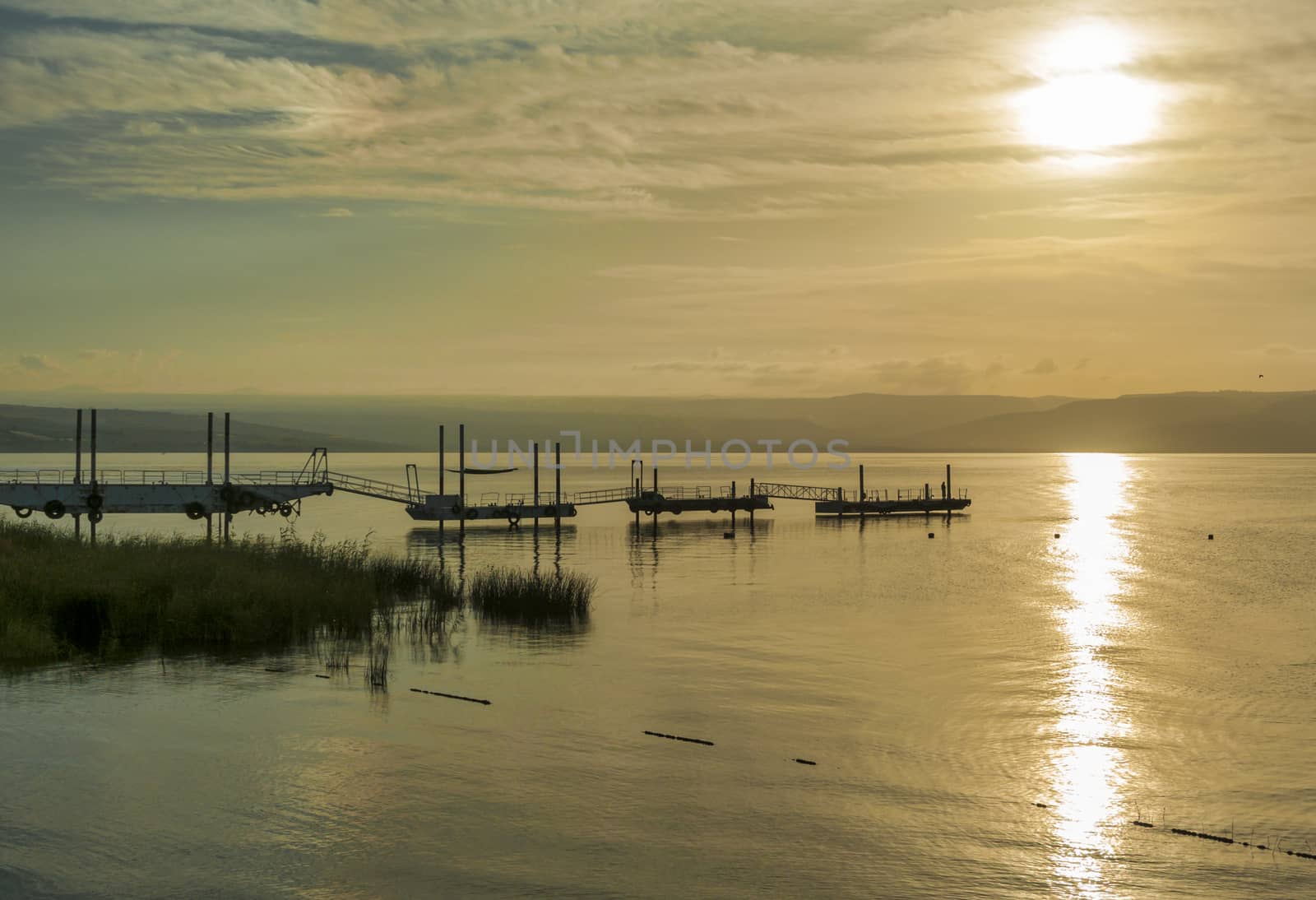 sunset over the lake of galilee or lake tiberias, know from the bibe, where Jesus walked on the water