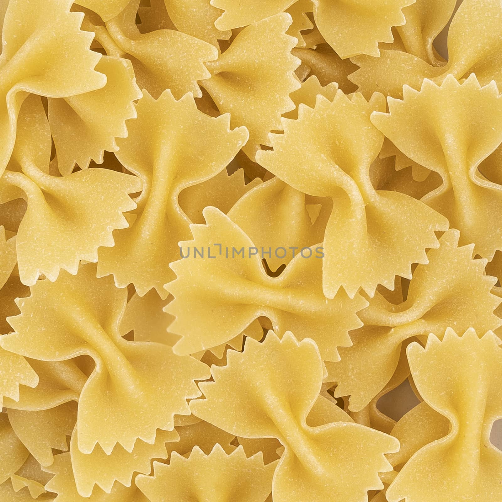 dried butterfly pasta as a background