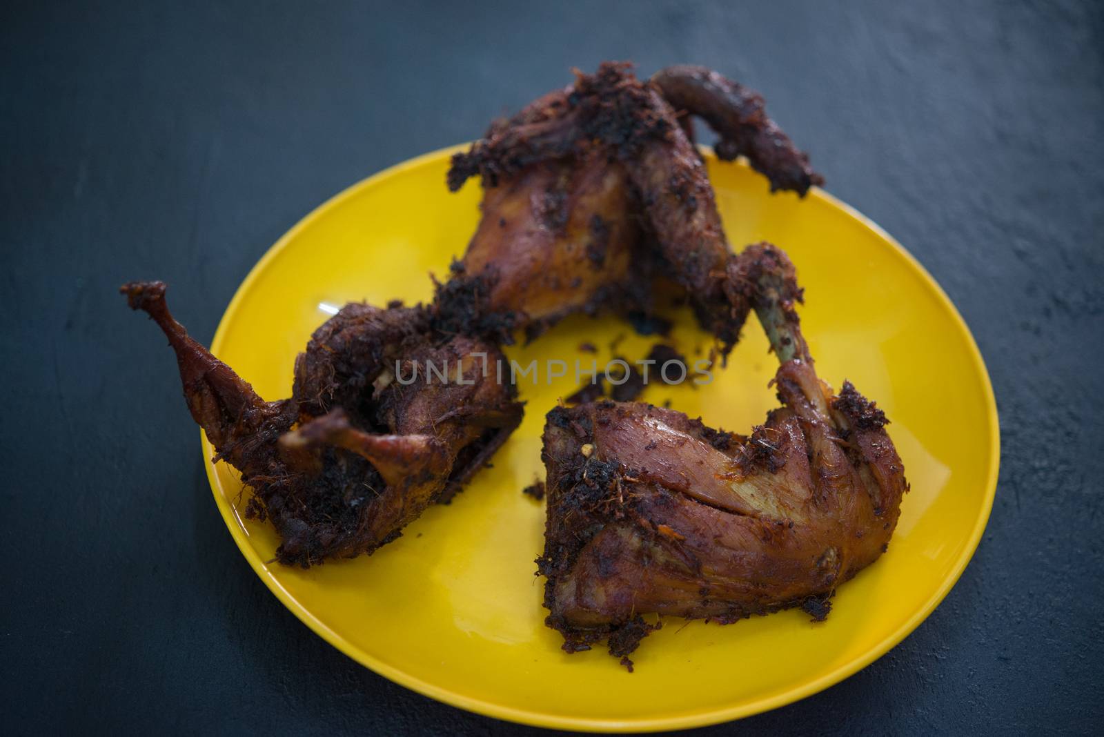 Traditional Malay style fried chicken with spices.