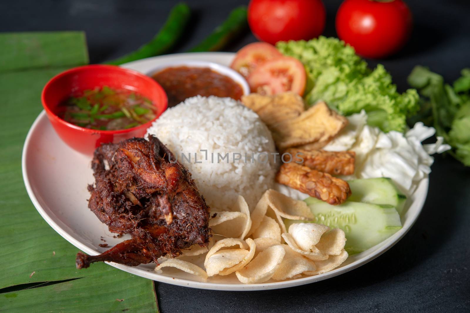 Nasi lemak kukus with quail meat, popular traditional Malaysian local food.