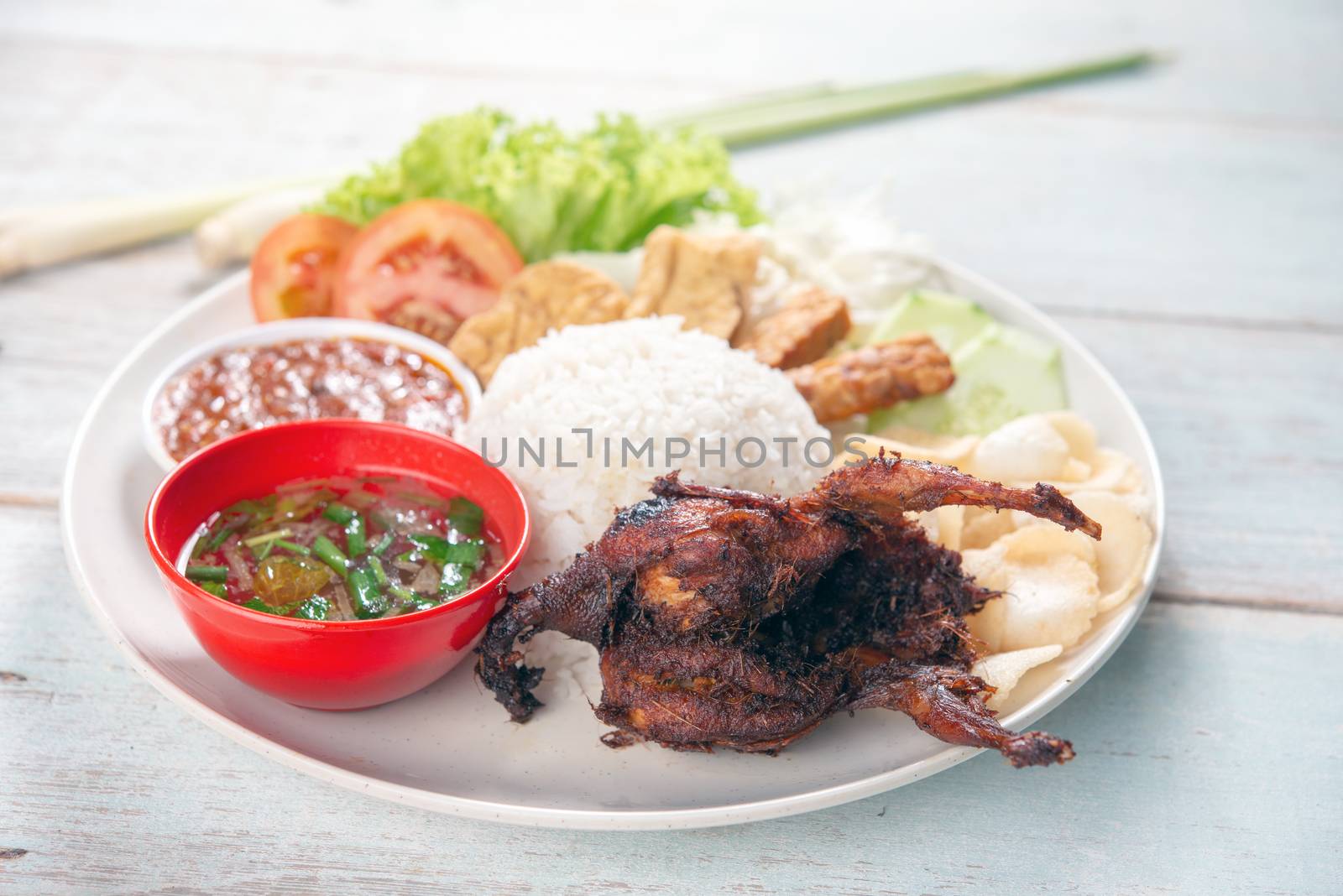 Nasi lemak kukus with quail meat, popular traditional Malaysian local food.