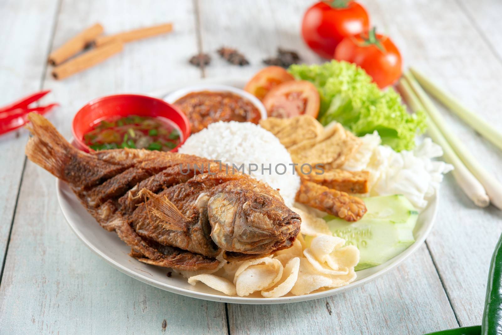 Fried tilapia fish and rice, popular traditional Malay or Indonesian local food.