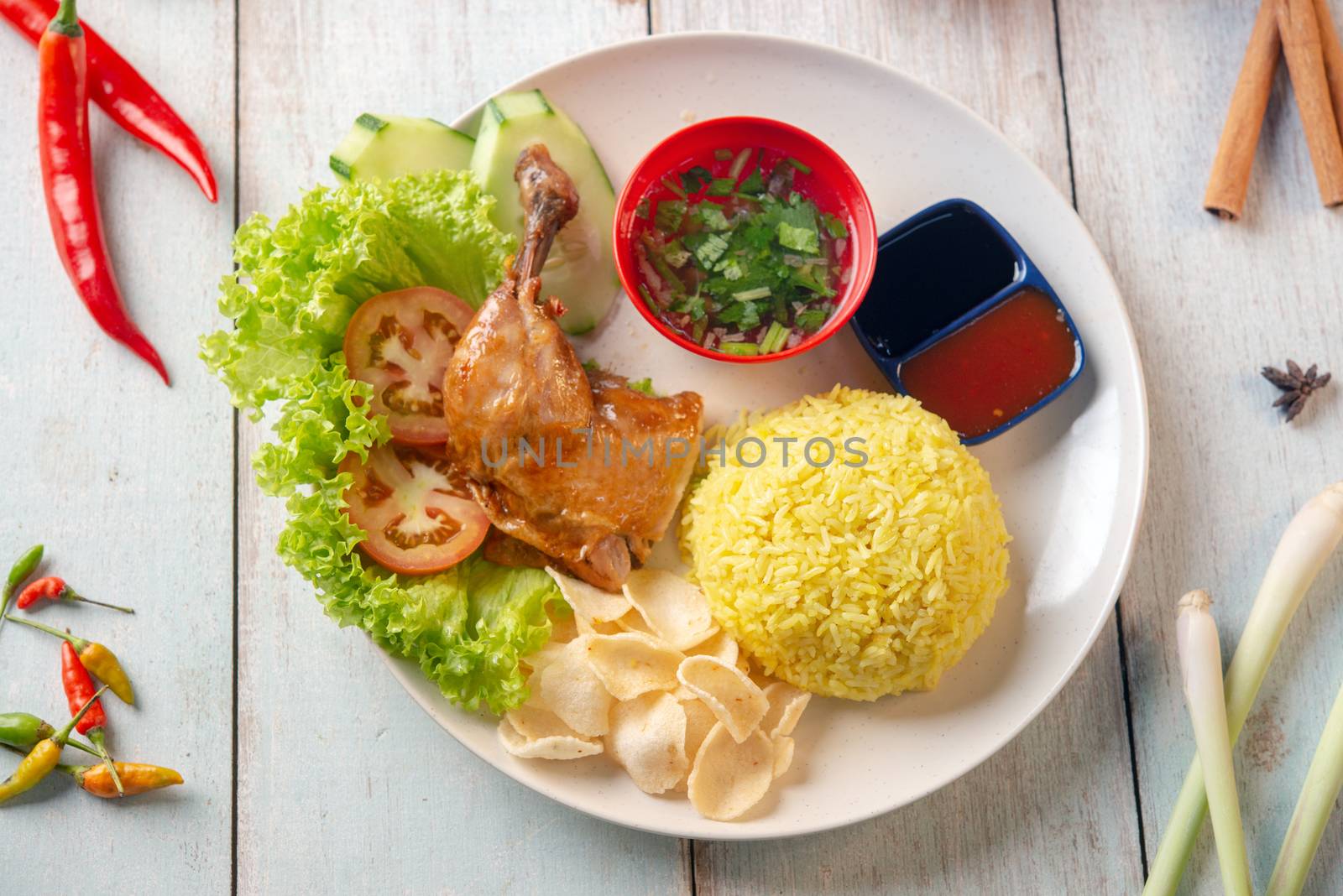 Chicken rice with drumstick, popular traditional Malaysian local food. Flat lay top down overhead view.
