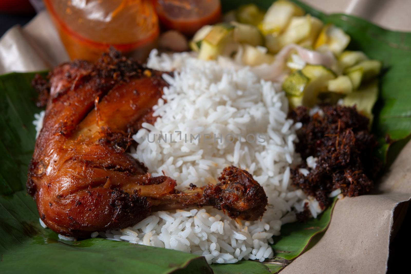 Nasi lemak kukus with chicken, popular traditional Malay local food.