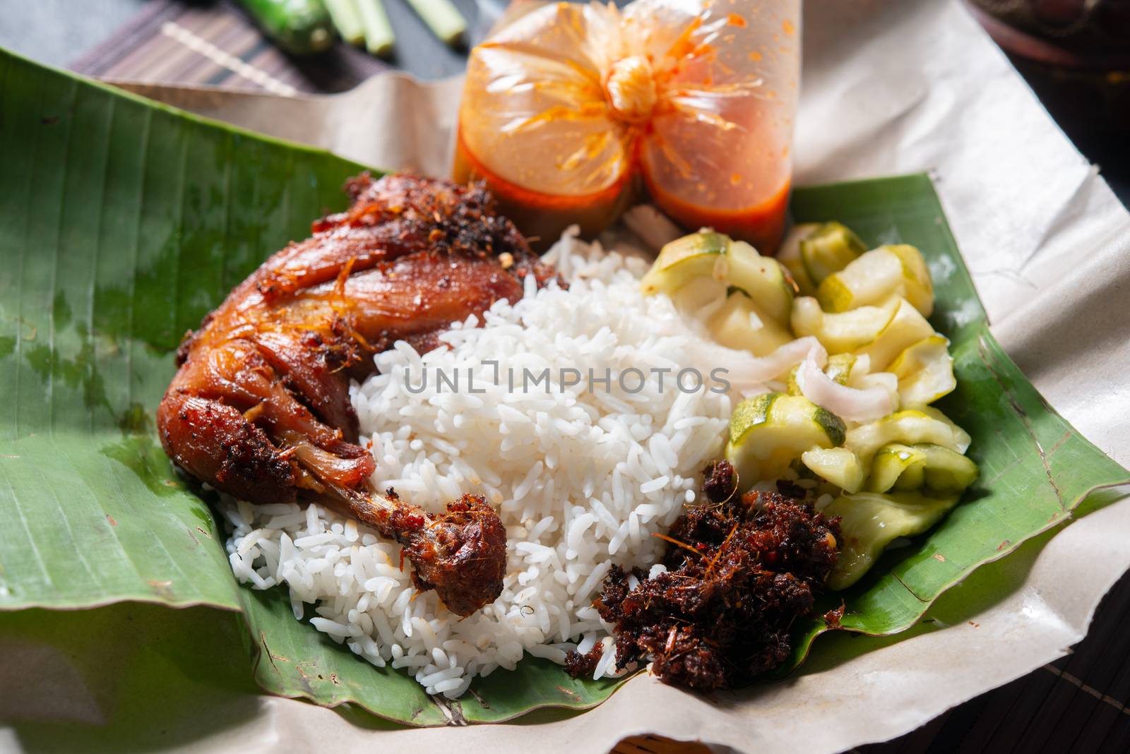 Nasi lemak kukus with chicken, popular traditional Malay local food.