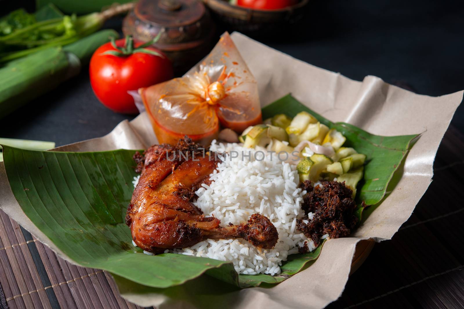 Nasi lemak kukus with chicken, popular traditional Malay local food.