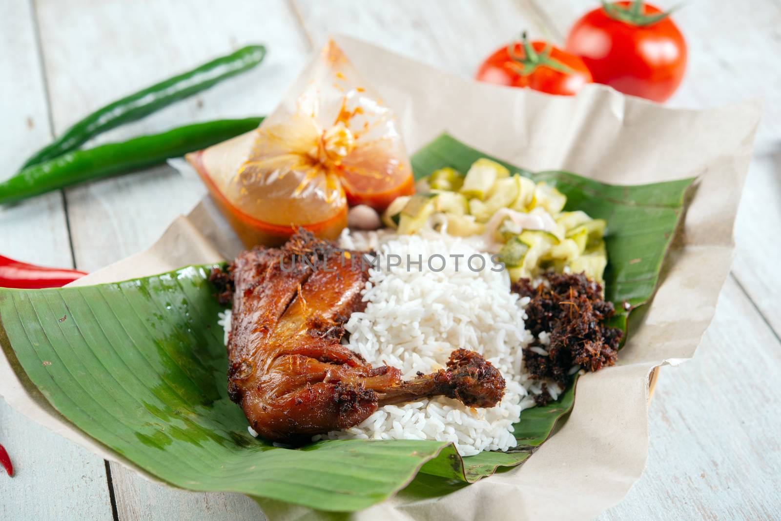 Nasi lemak kukus with chicken, popular traditional Malay local food.