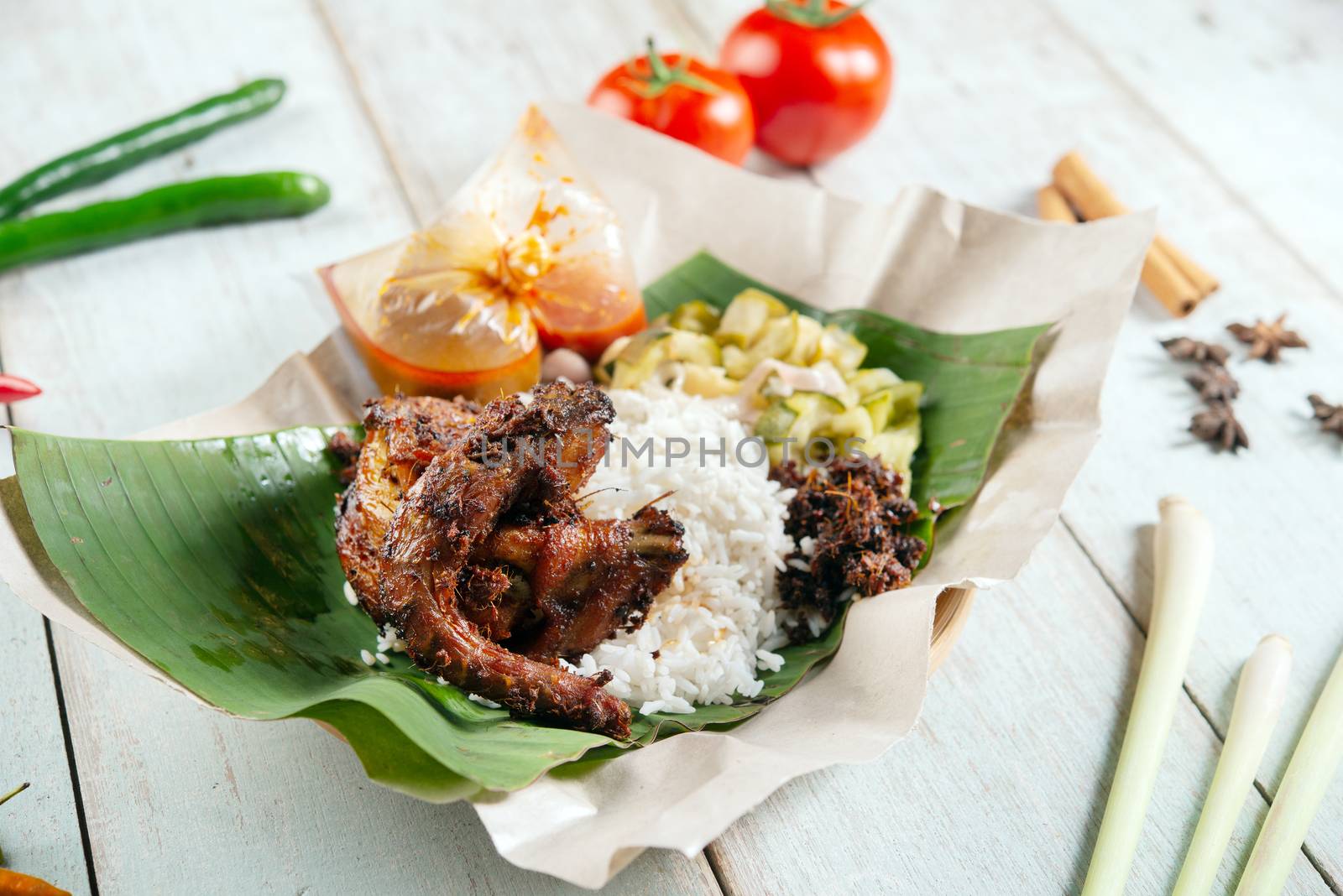 Nasi lemak kukus with quail, popular traditional Malay local food.