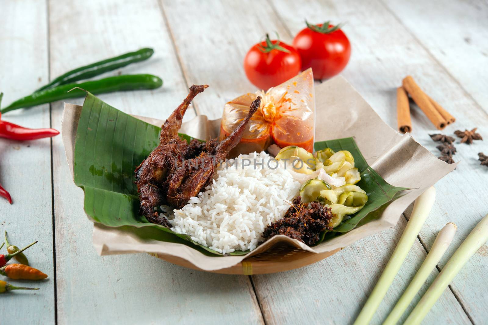 Nasi lemak kukus with quail, popular traditional Malay local food.