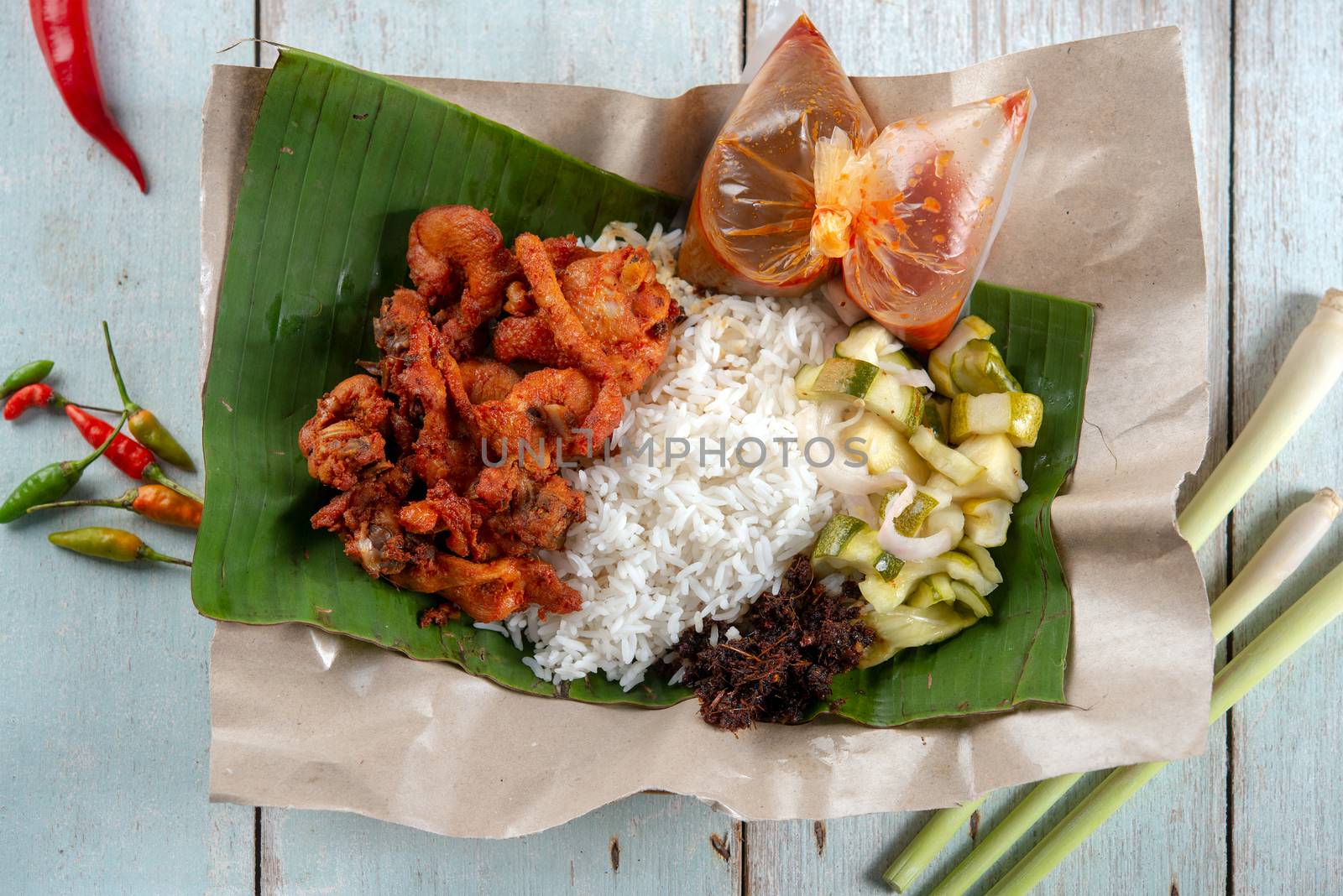 Nasi kukus ayam berempah, popular traditional Malay local food. Flat lay top down overhead view.