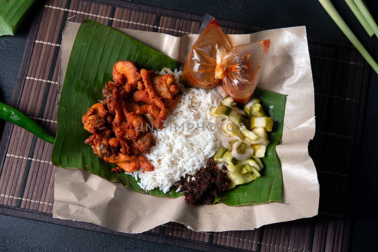 Nasi kukus ayam berempah, popular traditional Malay local food. Flat lay top down overhead view.