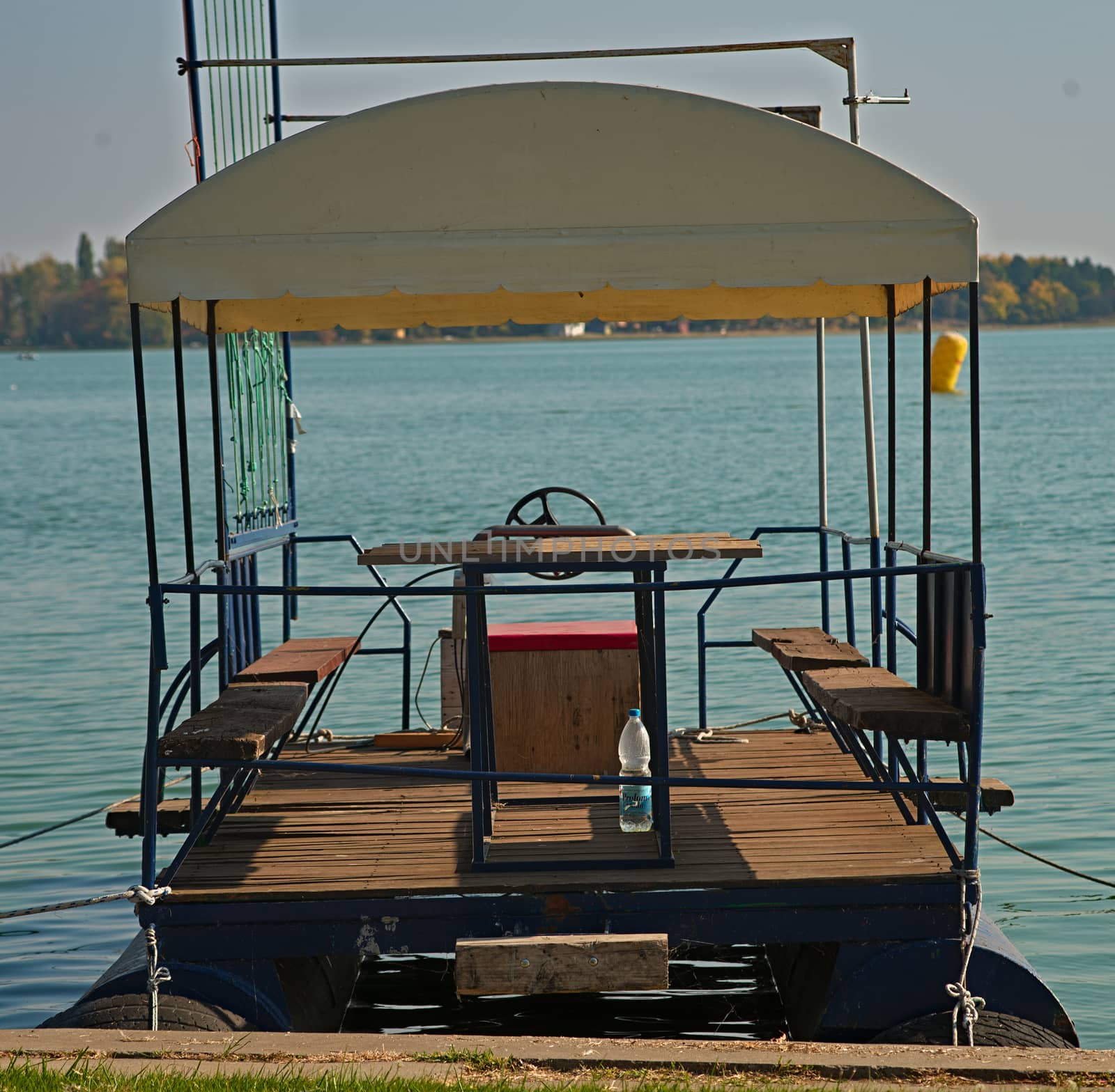 Floating raft docked at lake bank pier by sheriffkule