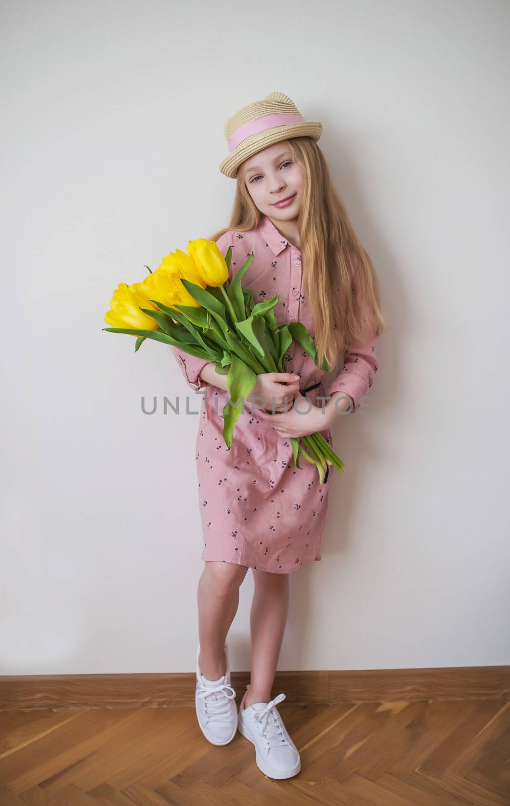 Teen girl in pink dress with yellow tulips by Angel_a