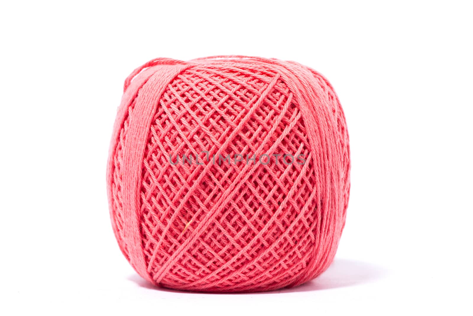 pink ball of yarn for knitting, isolate, homemade handicrafts by kasynets_olena