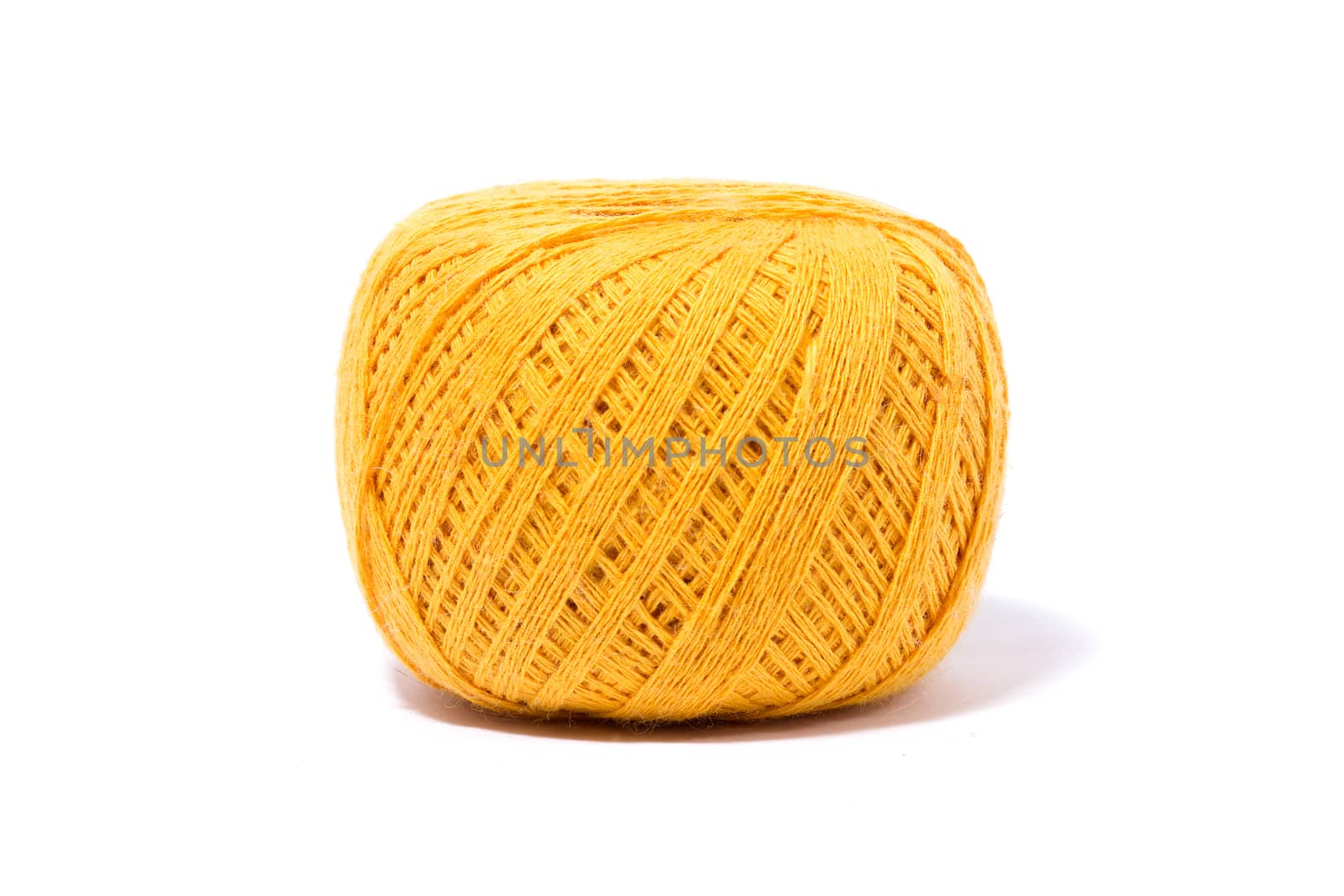 a ball of yellow knitting yarn, isolate, homemade handicrafts by kasynets_olena
