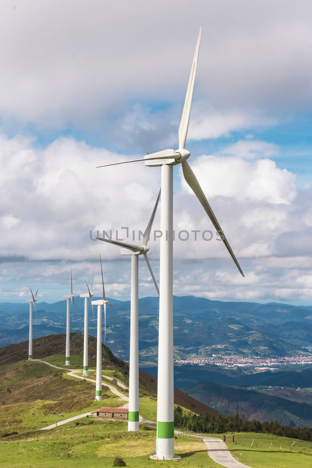 Renewable energy. Wind turbines, eolic park in scenic landscape of basque country, Spain. by HERRAEZ